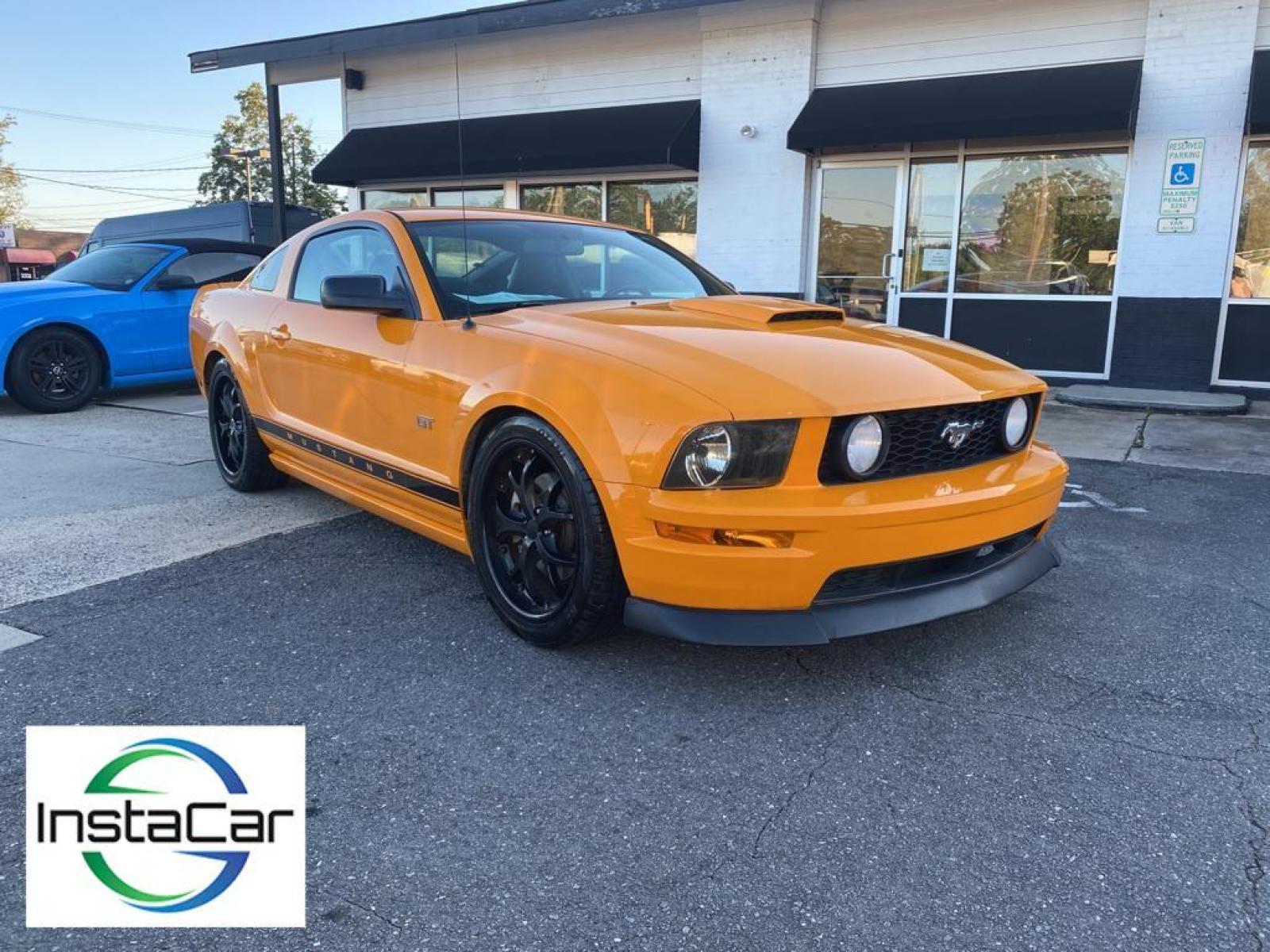 2007 Grabber Orange Clearcoat Metallic /Dark Charcoal Ford Mustang GT Premium (1ZVFT82H075) with an V8, 4.6L engine, 5-speed manual transmission, located at 3147 E Independence Blvd, Charlotte, NC, 28205, 35.200268, -80.773651 - <b>Equipment</b><br>The satellite radio system in this model gives you access to hundreds of nation-wide radio stations with a clear digital signal. Enjoy your music even more with the premium sound system in this unit. The leather seats in this vehicle are a must for buyers looking for comfort, du - Photo #6