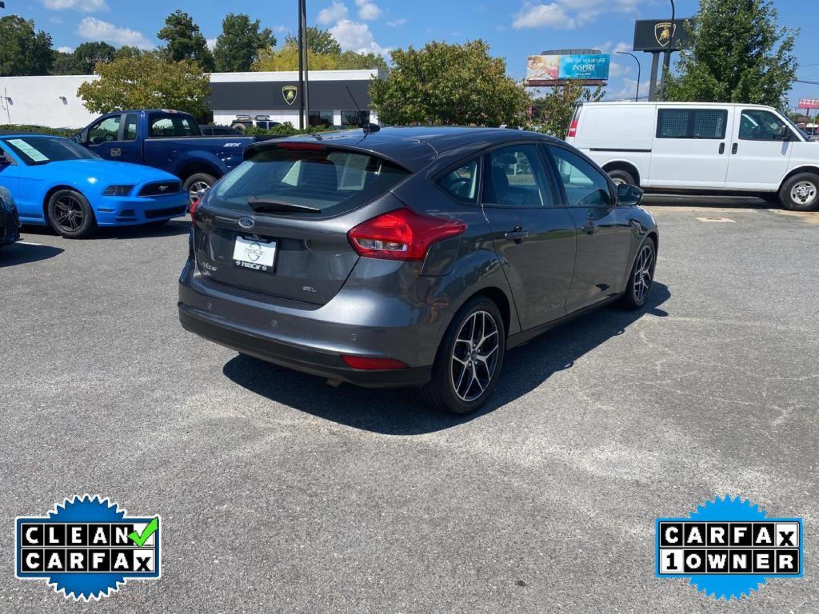 2017 Magnetic Metallic /Charcoal Black Ford Focus SEL (1FADP3M22HL) with an L4, 2.0L engine, 6-speed auto-shift manual transmission, located at 3147 E Independence Blvd, Charlotte, NC, 28205, 35.200268, -80.773651 - <b>Equipment</b><br>You'll never again be lost in a crowded city or a country region with the navigation system on this unit. Protect this Ford Focus from unwanted accidents with a cutting edge backup camera system. The Ford Focus has a premium sound system installed. The state of the art park assi - Photo #12