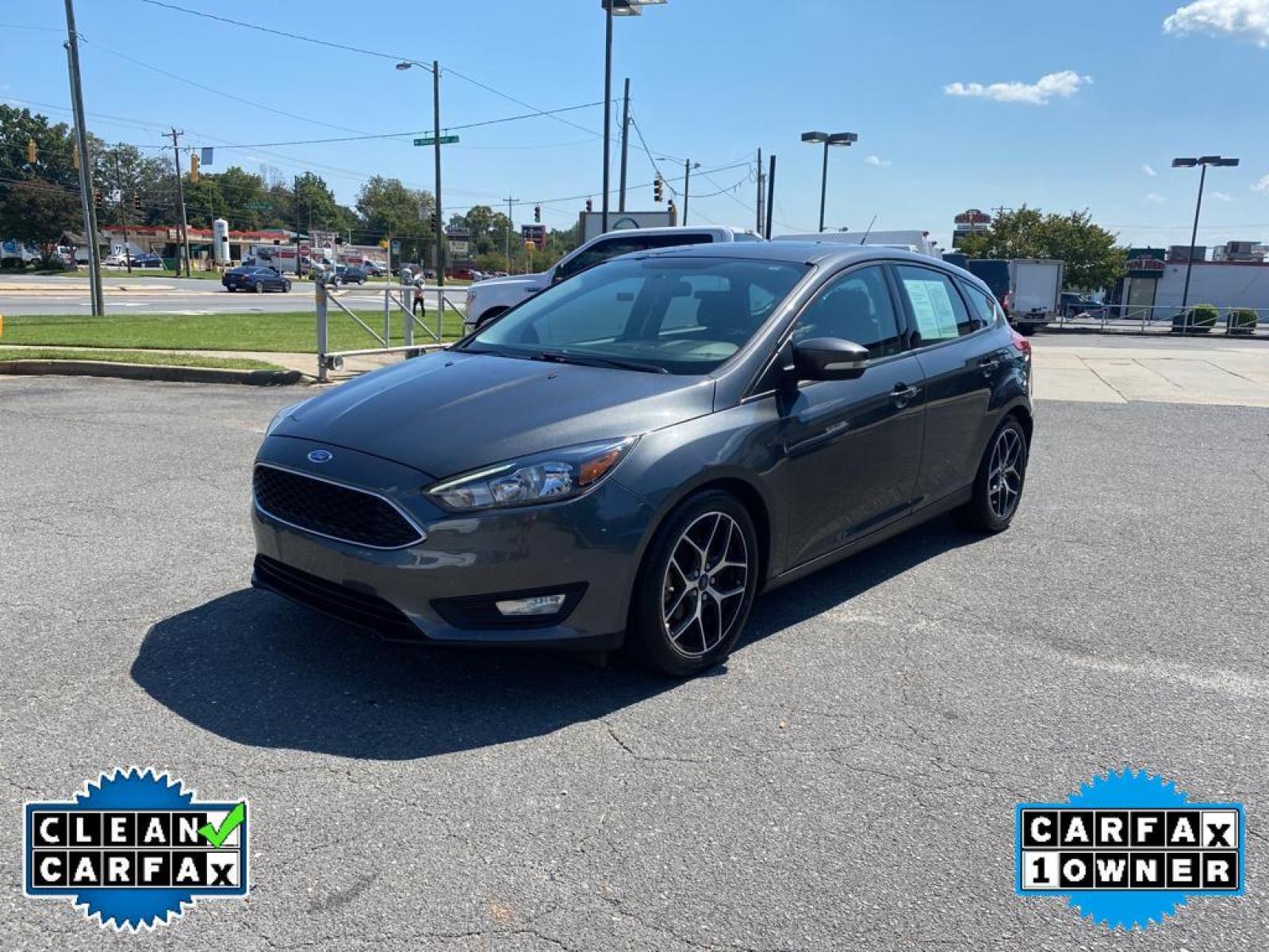 2017 Magnetic Metallic /Charcoal Black Ford Focus SEL (1FADP3M22HL) with an L4, 2.0L engine, 6-speed auto-shift manual transmission, located at 3147 E Independence Blvd, Charlotte, NC, 28205, 35.200268, -80.773651 - <b>Equipment</b><br>You'll never again be lost in a crowded city or a country region with the navigation system on this unit. Protect this Ford Focus from unwanted accidents with a cutting edge backup camera system. The Ford Focus has a premium sound system installed. The state of the art park assi - Photo #8