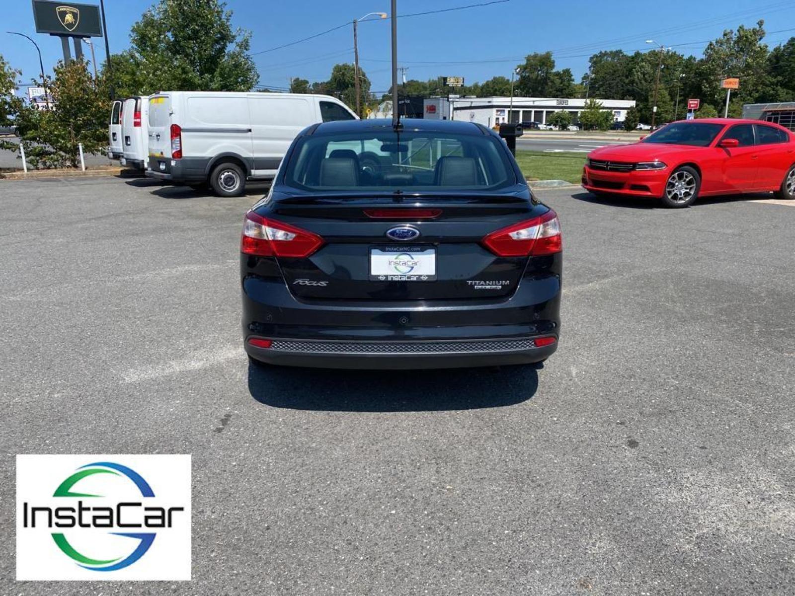 2014 Tuxedo Black Metallic /Charcoal Black Ford Focus Titanium (1FADP3J29EL) with an L4, 2.0L engine, 6-speed auto-shift manual transmission, located at 3147 E Independence Blvd, Charlotte, NC, 28205, 35.200268, -80.773651 - <b>Equipment</b><br>Enjoy your music even more with the premium sound system in this model. The installed navigation system will keep you on the right path. Bluetooth technology is built into this unit, keeping your hands on the steering wheel and your focus on the road. See what's behind you with t - Photo #10