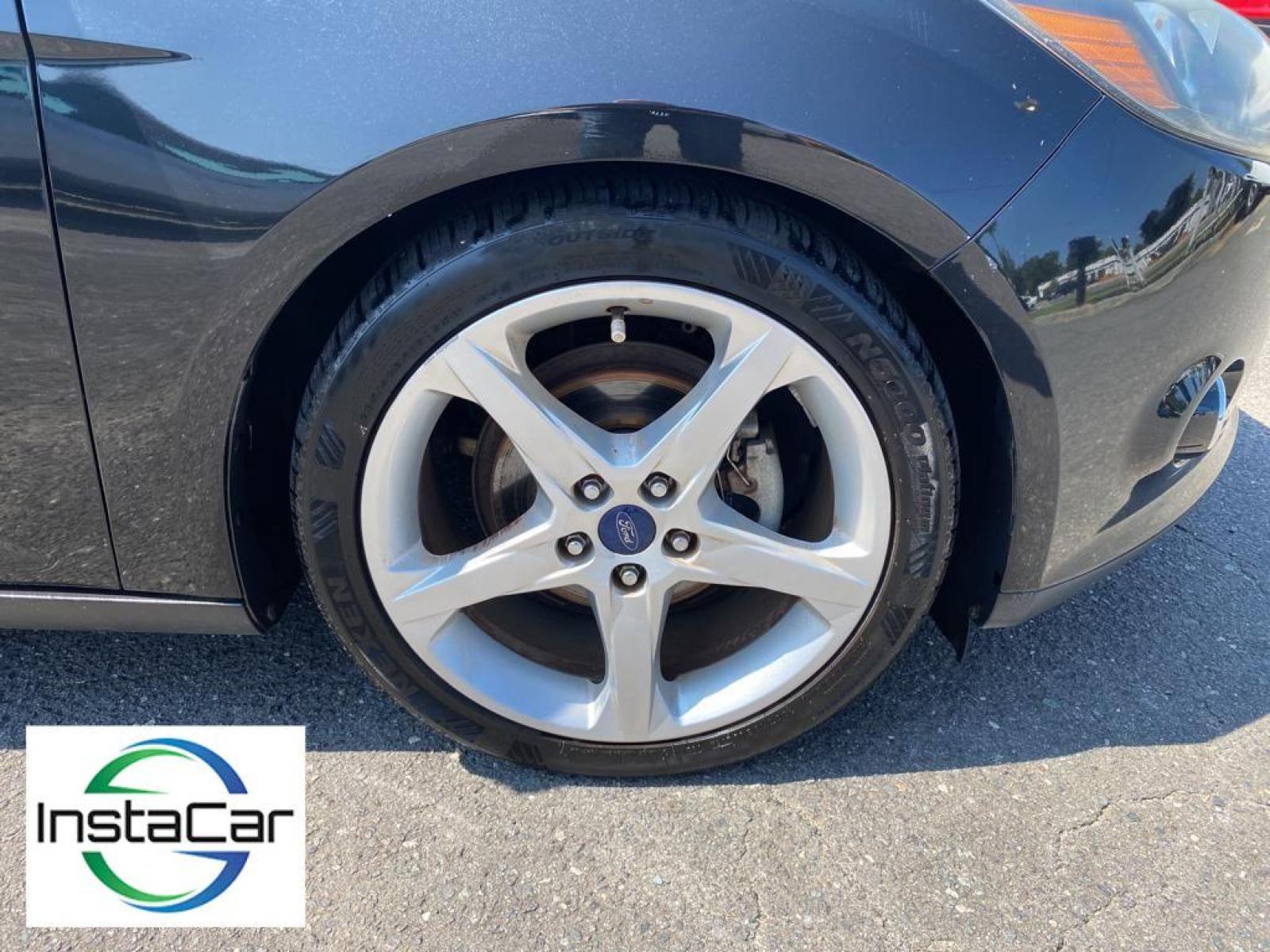 2014 Tuxedo Black Metallic /Charcoal Black Ford Focus Titanium (1FADP3J29EL) with an L4, 2.0L engine, 6-speed auto-shift manual transmission, located at 3147 E Independence Blvd, Charlotte, NC, 28205, 35.200268, -80.773651 - <b>Equipment</b><br>Enjoy your music even more with the premium sound system in this model. The installed navigation system will keep you on the right path. Bluetooth technology is built into this unit, keeping your hands on the steering wheel and your focus on the road. See what's behind you with t - Photo #14