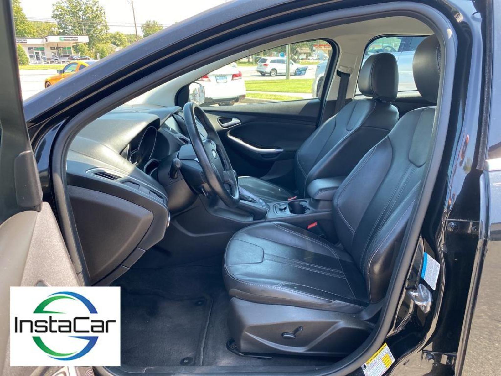 2014 Tuxedo Black Metallic /Charcoal Black Ford Focus Titanium (1FADP3J29EL) with an L4, 2.0L engine, 6-speed auto-shift manual transmission, located at 3147 E Independence Blvd, Charlotte, NC, 28205, 35.200268, -80.773651 - <b>Equipment</b><br>Enjoy your music even more with the premium sound system in this model. The installed navigation system will keep you on the right path. Bluetooth technology is built into this unit, keeping your hands on the steering wheel and your focus on the road. See what's behind you with t - Photo #22