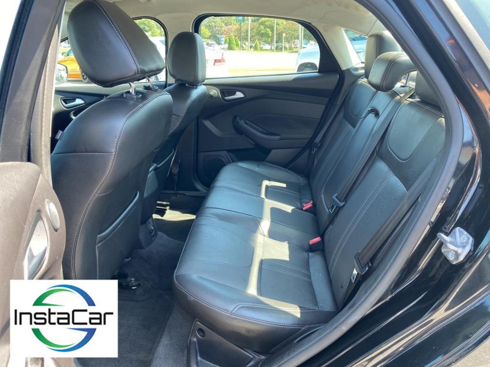 2014 Tuxedo Black Metallic /Charcoal Black Ford Focus Titanium (1FADP3J29EL) with an L4, 2.0L engine, 6-speed auto-shift manual transmission, located at 3147 E Independence Blvd, Charlotte, NC, 28205, 35.200268, -80.773651 - <b>Equipment</b><br>Enjoy your music even more with the premium sound system in this model. The installed navigation system will keep you on the right path. Bluetooth technology is built into this unit, keeping your hands on the steering wheel and your focus on the road. See what's behind you with t - Photo #24
