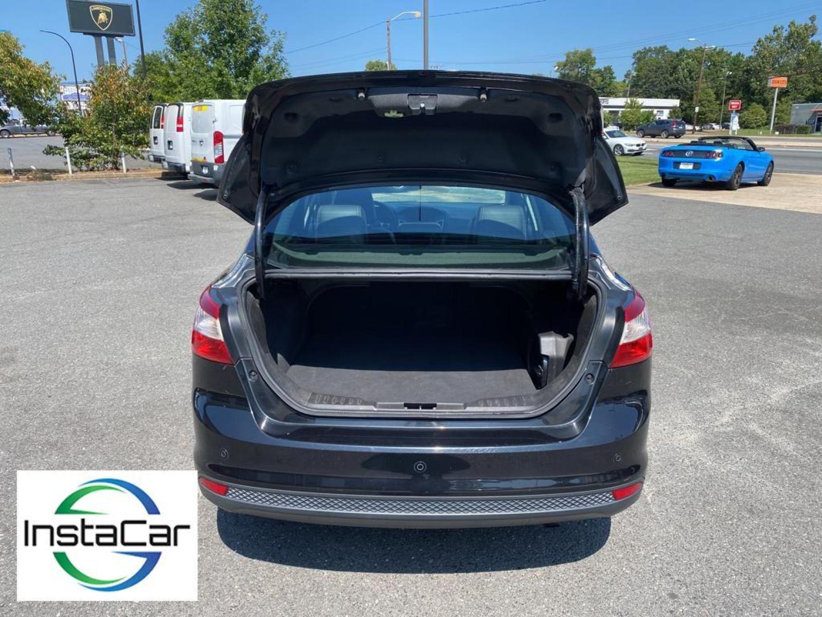 2014 Tuxedo Black Metallic /Charcoal Black Ford Focus Titanium (1FADP3J29EL) with an L4, 2.0L engine, 6-speed auto-shift manual transmission, located at 3147 E Independence Blvd, Charlotte, NC, 28205, 35.200268, -80.773651 - <b>Equipment</b><br>Enjoy your music even more with the premium sound system in this model. The installed navigation system will keep you on the right path. Bluetooth technology is built into this unit, keeping your hands on the steering wheel and your focus on the road. See what's behind you with t - Photo #32