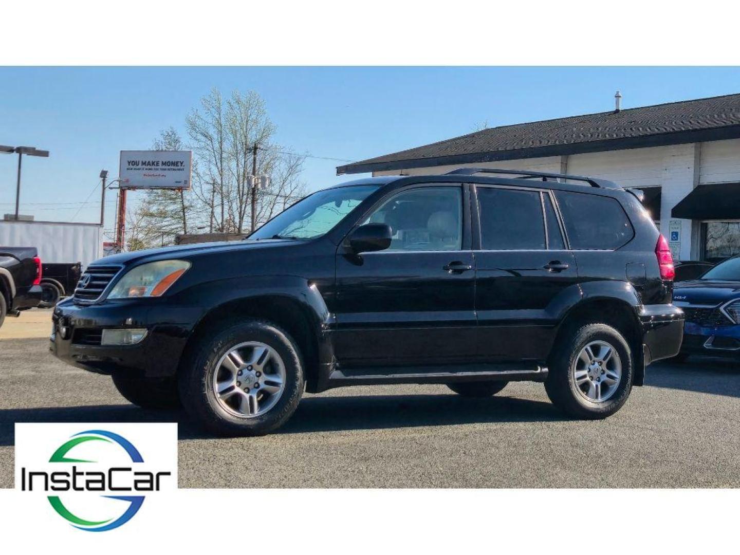 2005 Black Onyx /Ivory Lexus GX 470 Base (JTJBT20X250) with an V8, 4.7L engine, 5-speed automatic transmission, located at 6520 E. Independence Blvd., Charlotte, NC, 28212, 35.146019, -80.723465 - <b>Equipment</b><br>The leather seats in this mid-size suv are a must for buyers looking for comfort, durability, and style. This mid-size suv keeps you comfortable with Auto Climate. The installed navigation system will keep you on the right path. Protect this unit from unwanted accidents with a cu - Photo#1