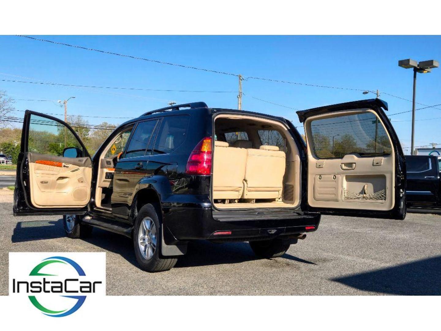 2005 Black Onyx /Ivory Lexus GX 470 Base (JTJBT20X250) with an V8, 4.7L engine, 5-speed automatic transmission, located at 6520 E. Independence Blvd., Charlotte, NC, 28212, 35.146019, -80.723465 - <b>Equipment</b><br>The leather seats in this mid-size suv are a must for buyers looking for comfort, durability, and style. This mid-size suv keeps you comfortable with Auto Climate. The installed navigation system will keep you on the right path. Protect this unit from unwanted accidents with a cu - Photo#3