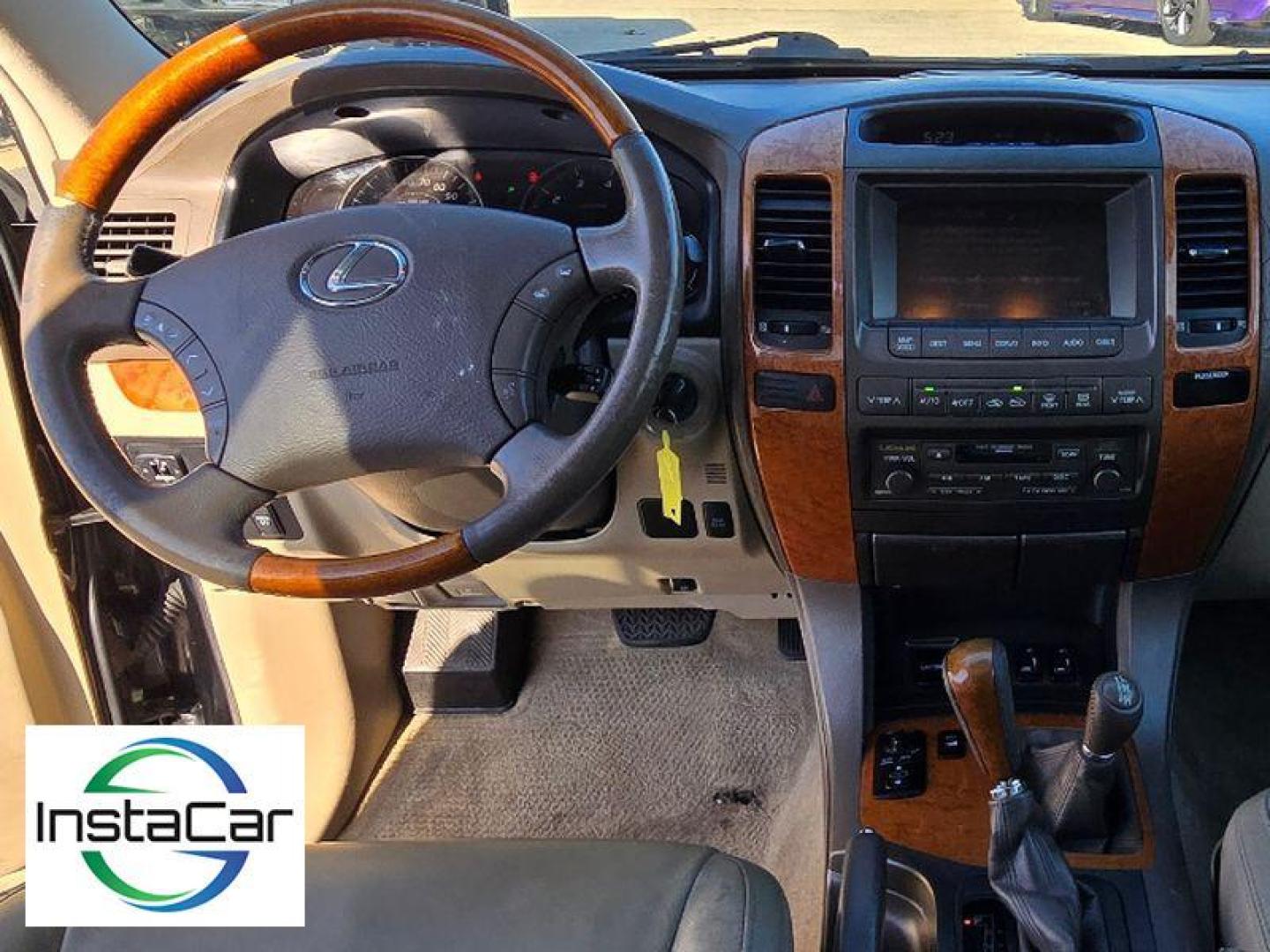 2005 Black Onyx /Ivory Lexus GX 470 Base (JTJBT20X250) with an V8, 4.7L engine, 5-speed automatic transmission, located at 6520 E. Independence Blvd., Charlotte, NC, 28212, 35.146019, -80.723465 - <b>Equipment</b><br>The leather seats in this mid-size suv are a must for buyers looking for comfort, durability, and style. This mid-size suv keeps you comfortable with Auto Climate. The installed navigation system will keep you on the right path. Protect this unit from unwanted accidents with a cu - Photo#6