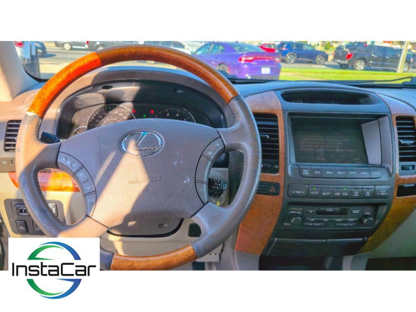 2005 Black Onyx /Ivory Lexus GX 470 Base (JTJBT20X250) with an V8, 4.7L engine, 5-speed automatic transmission, located at 6520 E. Independence Blvd., Charlotte, NC, 28212, 35.146019, -80.723465 - <b>Equipment</b><br>The leather seats in this mid-size suv are a must for buyers looking for comfort, durability, and style. This mid-size suv keeps you comfortable with Auto Climate. The installed navigation system will keep you on the right path. Protect this unit from unwanted accidents with a cu - Photo#9