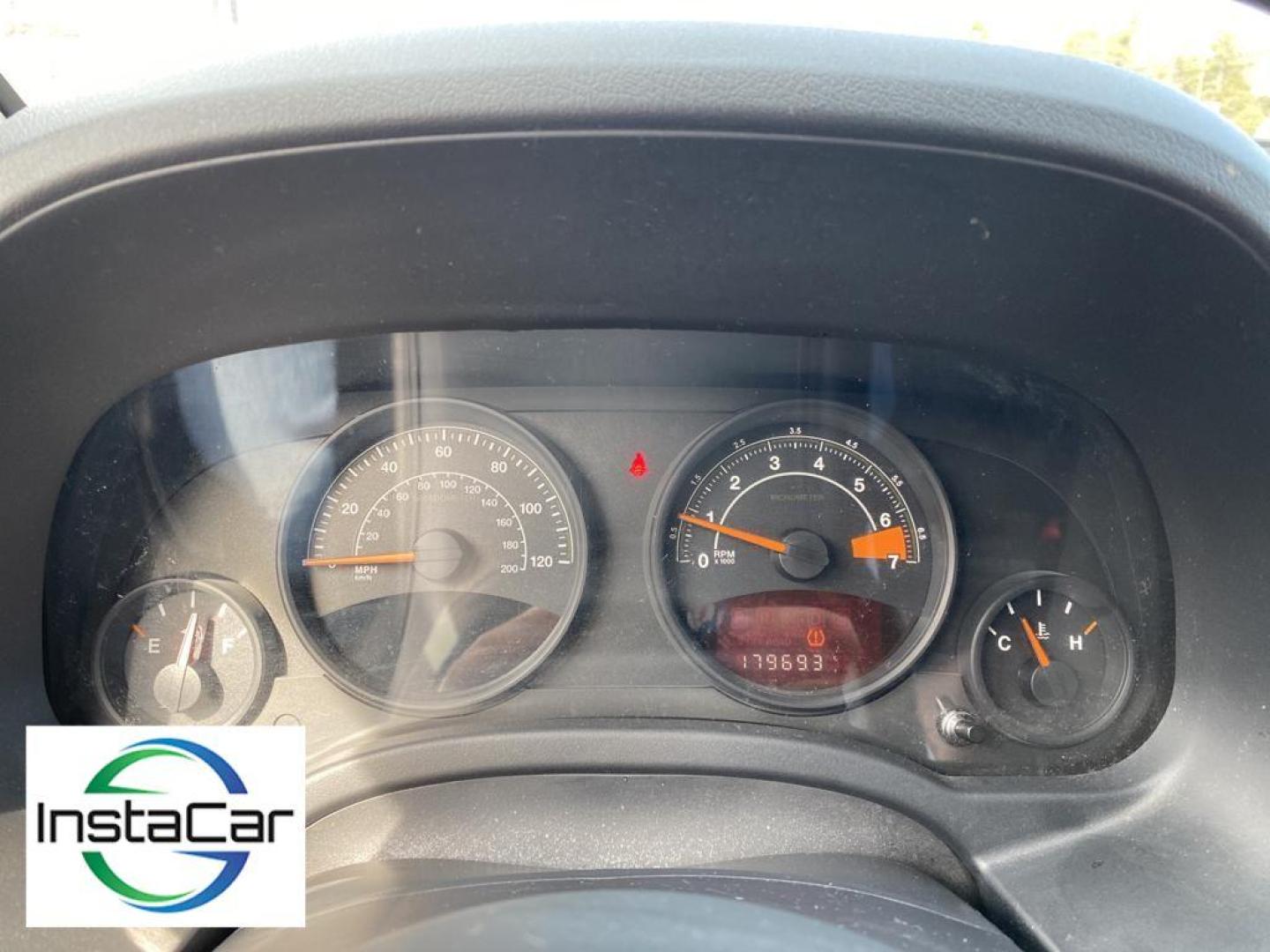2014 Black Clearcoat /Dark Slate Gray Jeep Compass Sport (1C4NJCBA9ED) with an L4, 2.0L engine, 5-speed manual transmission, located at 3147 E Independence Blvd, Charlotte, NC, 28205, 35.200268, -80.773651 - Introducing the impeccable 2014 Jeep Compass Sport, now available at our esteemed dealership. This used gem has been meticulously maintained and is ready to embark on its next adventure with you. With a remarkable mileage of 179,461 miles, this SUV has proven its reliability and longevity, making it - Photo#3