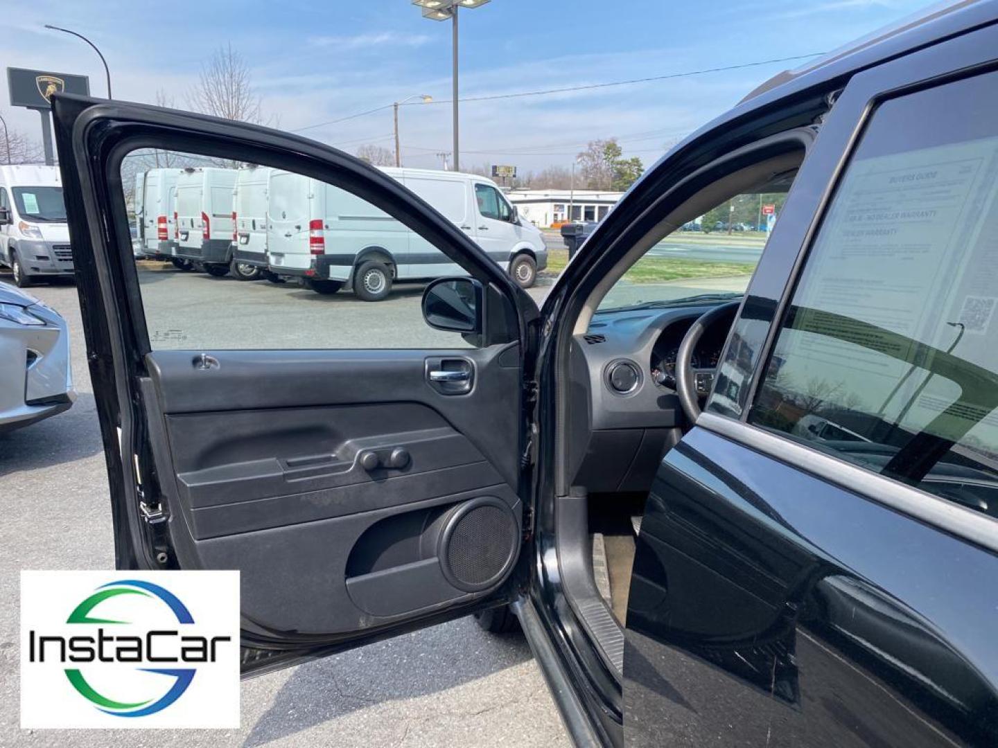 2014 Black Clearcoat /Dark Slate Gray Jeep Compass Sport (1C4NJCBA9ED) with an L4, 2.0L engine, 5-speed manual transmission, located at 3147 E Independence Blvd, Charlotte, NC, 28205, 35.200268, -80.773651 - Introducing the impeccable 2014 Jeep Compass Sport, now available at our esteemed dealership. This used gem has been meticulously maintained and is ready to embark on its next adventure with you. With a remarkable mileage of 179,461 miles, this SUV has proven its reliability and longevity, making it - Photo#19