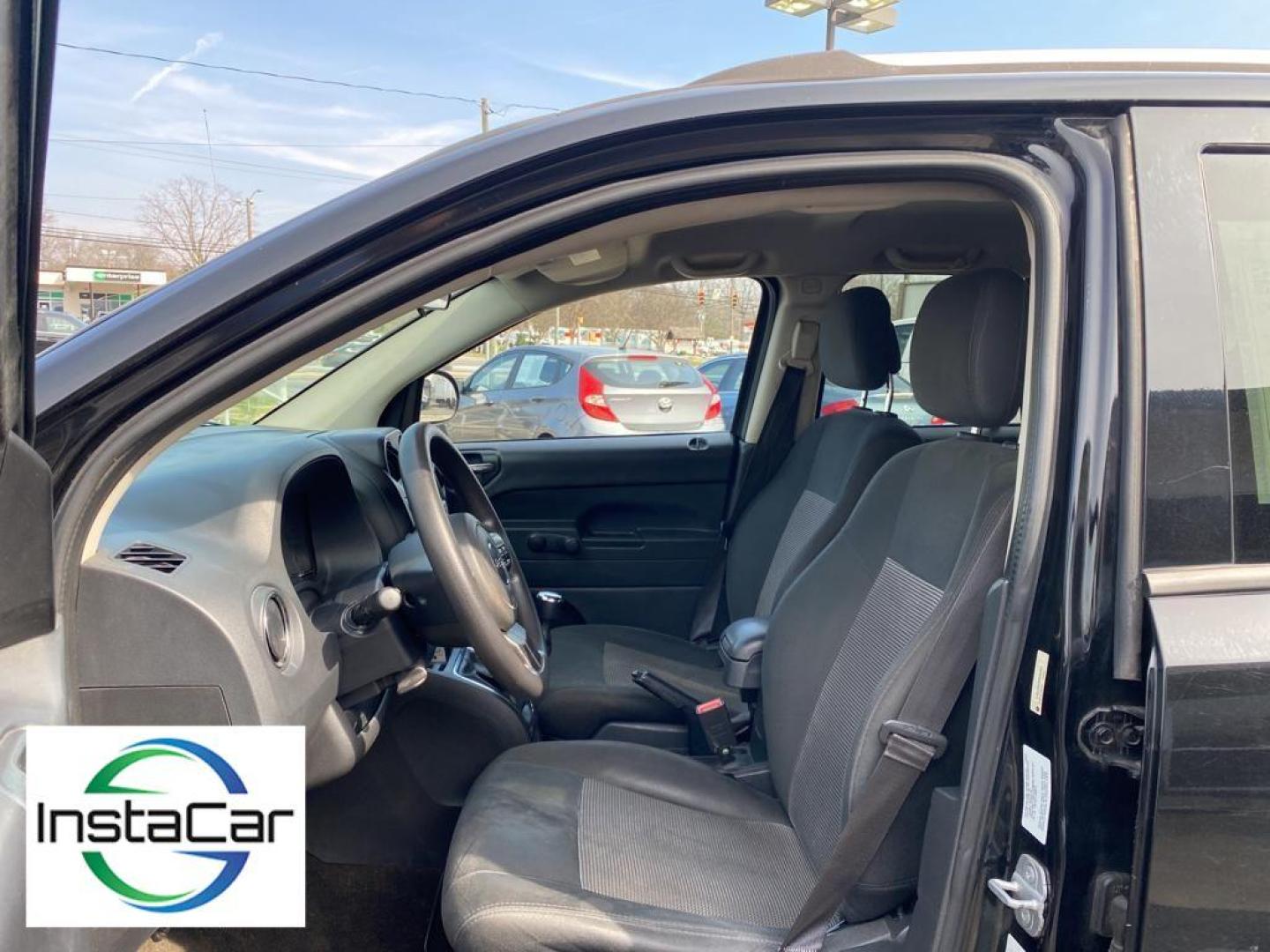 2014 Black Clearcoat /Dark Slate Gray Jeep Compass Sport (1C4NJCBA9ED) with an L4, 2.0L engine, 5-speed manual transmission, located at 3147 E Independence Blvd, Charlotte, NC, 28205, 35.200268, -80.773651 - Introducing the impeccable 2014 Jeep Compass Sport, now available at our esteemed dealership. This used gem has been meticulously maintained and is ready to embark on its next adventure with you. With a remarkable mileage of 179,461 miles, this SUV has proven its reliability and longevity, making it - Photo#23