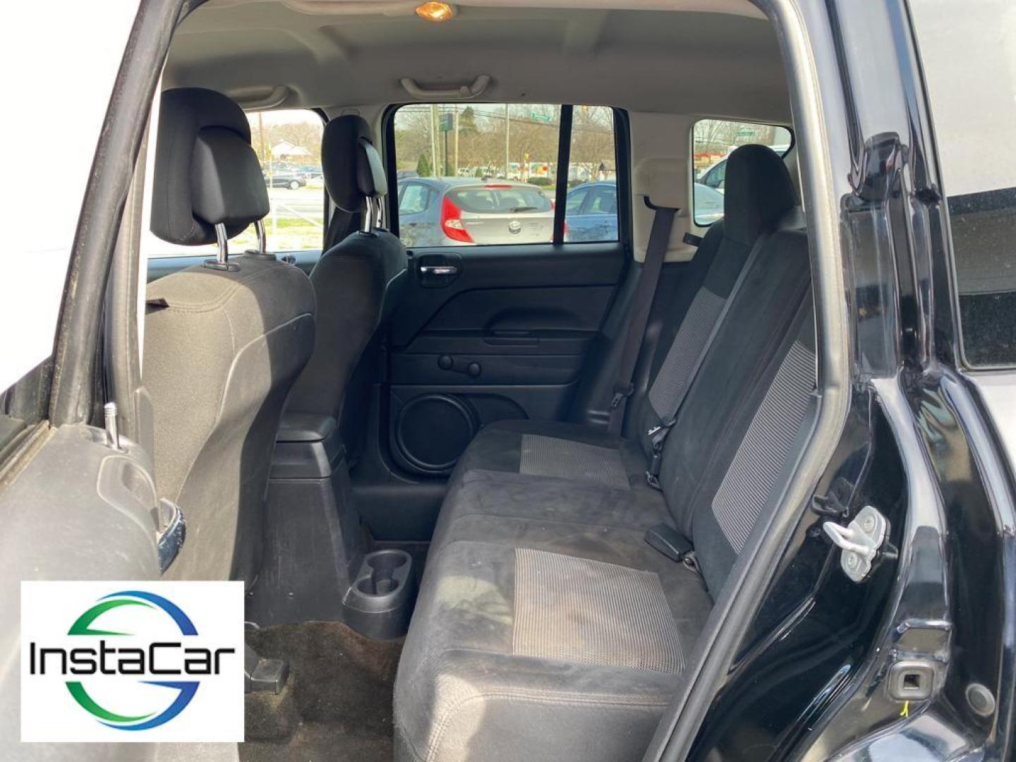 2014 Black Clearcoat /Dark Slate Gray Jeep Compass Sport (1C4NJCBA9ED) with an L4, 2.0L engine, 5-speed manual transmission, located at 3147 E Independence Blvd, Charlotte, NC, 28205, 35.200268, -80.773651 - Introducing the impeccable 2014 Jeep Compass Sport, now available at our esteemed dealership. This used gem has been meticulously maintained and is ready to embark on its next adventure with you. With a remarkable mileage of 179,461 miles, this SUV has proven its reliability and longevity, making it - Photo#24