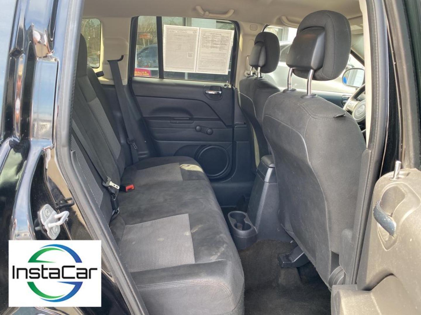 2014 Black Clearcoat /Dark Slate Gray Jeep Compass Sport (1C4NJCBA9ED) with an L4, 2.0L engine, 5-speed manual transmission, located at 3147 E Independence Blvd, Charlotte, NC, 28205, 35.200268, -80.773651 - Introducing the impeccable 2014 Jeep Compass Sport, now available at our esteemed dealership. This used gem has been meticulously maintained and is ready to embark on its next adventure with you. With a remarkable mileage of 179,461 miles, this SUV has proven its reliability and longevity, making it - Photo#25
