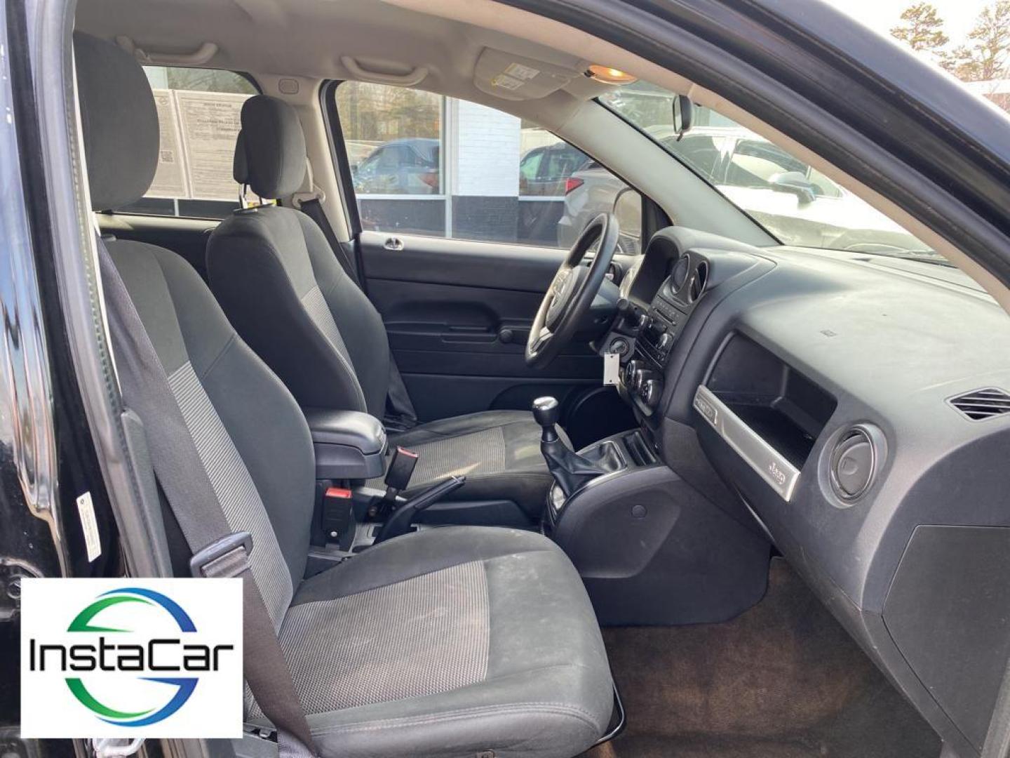 2014 Black Clearcoat /Dark Slate Gray Jeep Compass Sport (1C4NJCBA9ED) with an L4, 2.0L engine, 5-speed manual transmission, located at 3147 E Independence Blvd, Charlotte, NC, 28205, 35.200268, -80.773651 - Introducing the impeccable 2014 Jeep Compass Sport, now available at our esteemed dealership. This used gem has been meticulously maintained and is ready to embark on its next adventure with you. With a remarkable mileage of 179,461 miles, this SUV has proven its reliability and longevity, making it - Photo#26