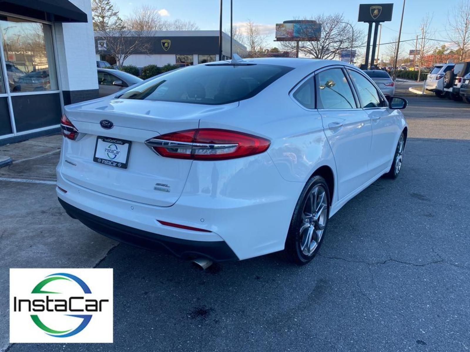2019 WHITE Ford Fusion SEL (3FA6P0CD0KR) with an 1.5 liter 4 Cylinder Engine engine, 6-SPEED AUTOMATIC W/PADDLE SHIFTERS transmission, located at 3147 E Independence Blvd, Charlotte, NC, 28205, 35.200268, -80.773651 - This vehicle features a hands-free Bluetooth phone system. The rear parking assist technology on this vehicle will put you at ease when reversing. The system alerts you as you get closer to an obstruction. See what's behind you with the back up camera on the Ford Fusion. Front wheel drive on this 2 - Photo #12