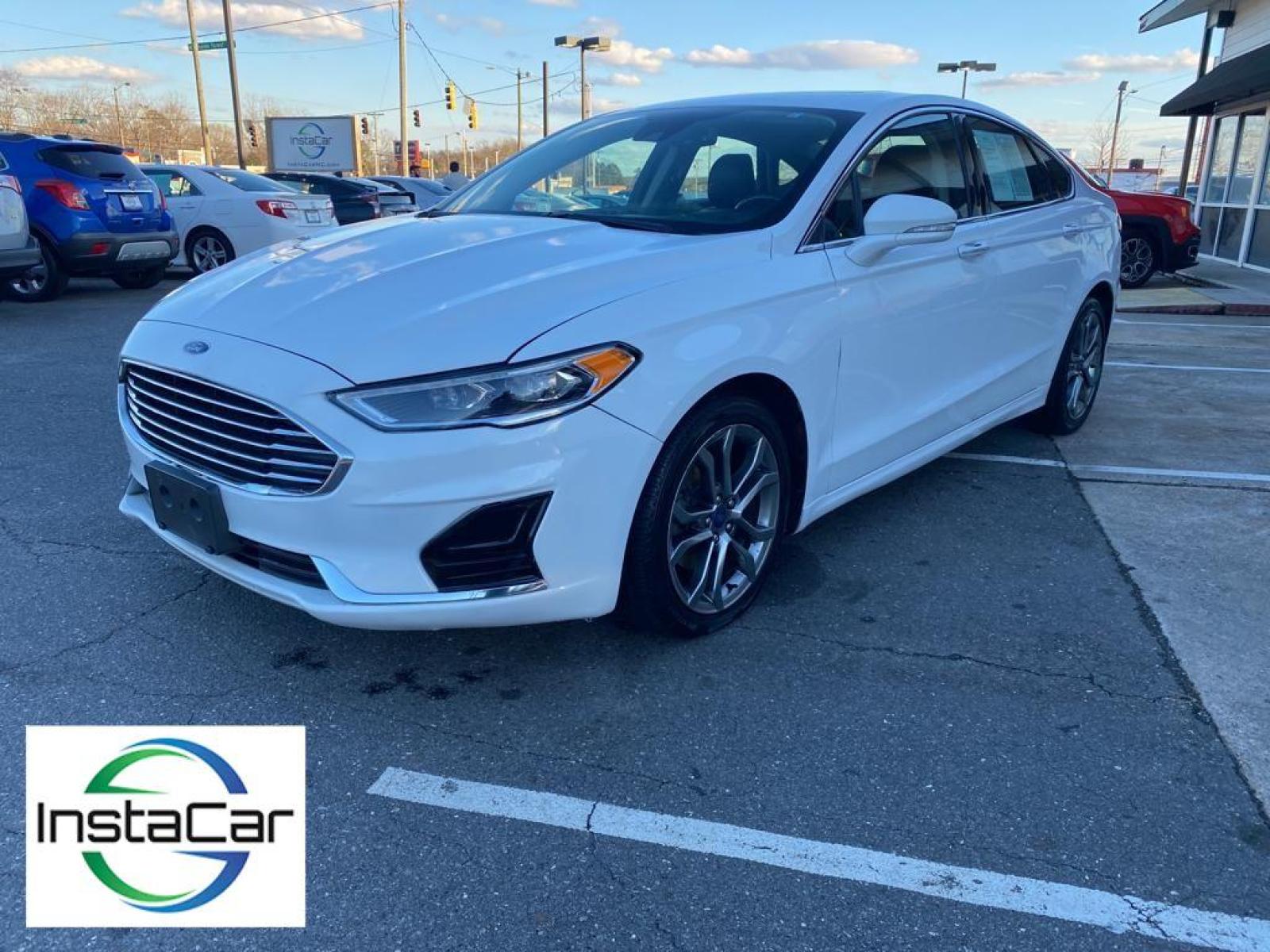 2019 WHITE Ford Fusion SEL (3FA6P0CD0KR) with an 1.5 liter 4 Cylinder Engine engine, 6-SPEED AUTOMATIC W/PADDLE SHIFTERS transmission, located at 3147 E Independence Blvd, Charlotte, NC, 28205, 35.200268, -80.773651 - This vehicle features a hands-free Bluetooth phone system. The rear parking assist technology on this vehicle will put you at ease when reversing. The system alerts you as you get closer to an obstruction. See what's behind you with the back up camera on the Ford Fusion. Front wheel drive on this 2 - Photo #8